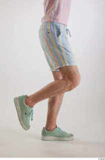 Tony  1 casual dressed flexing leg mint sneakers side…